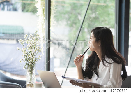 businesswoman analyze market chart at workplace. young female entrepreneur woman working with business document at office. analytic financial accounting plan report. 37170761