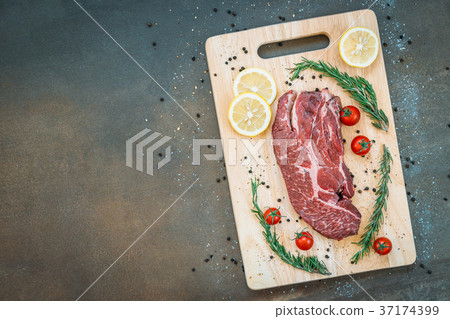 Raw beef meat on cutting board 37174399