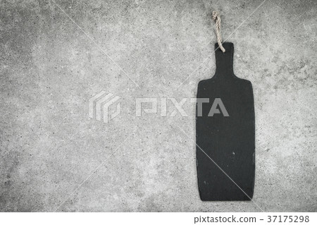 Slate on black stone background Slate on black stone background 37175298