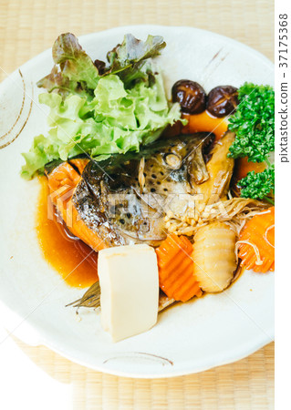 Boiled Head of salmon fish with sweet sauce and vegetable 37175368
