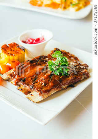 Grilled pork ribs with bbq sauce Grilled pork ribs with bbq sauce 37175369