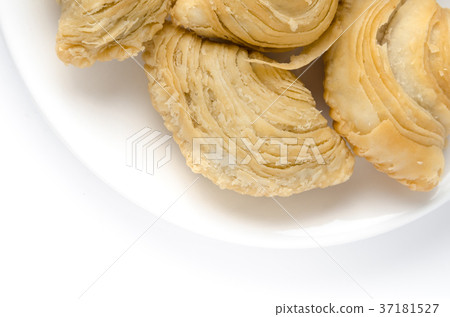 Curry puff on white dish with copyspace Curry puff on white dish with copyspace 37181527