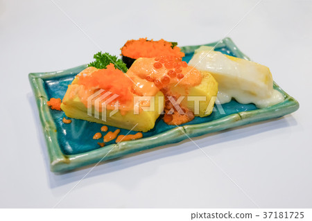 Japanese rolled eggs on white table. Japanese rolled eggs on white table. 37181725