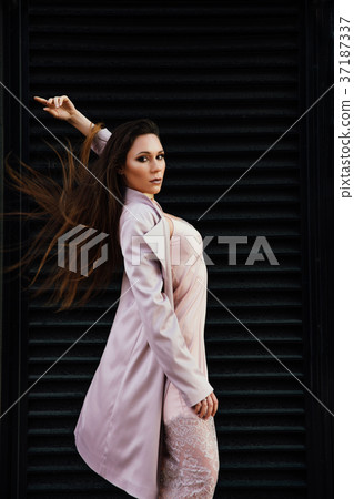 Fashion portrait of a sexy girl in a coat and Fashion portrait of a sexy girl in a coat and 37187337
