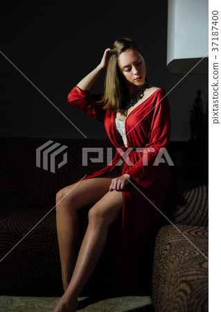 Beautiful sexy lady in elegant red robe. Fashion Beautiful sexy lady in elegant red robe. Fashion 37187400