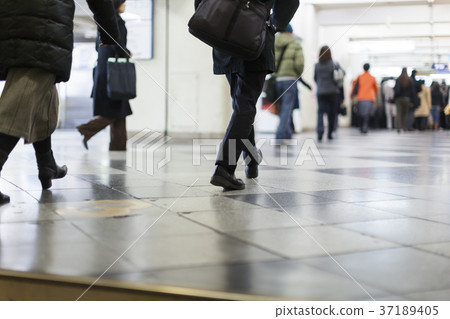 Feet of office worker walking 37189405