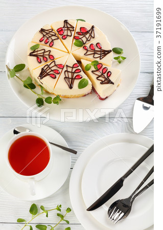 cheescake, cup of tea and plates cheescake, cup of tea and plates 37191699