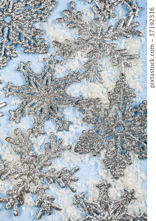 Silvery snowflakes on a blue background Silvery snowflakes on a blue background 37192316