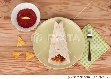 Chili Con Carne on tortilla wrap with salsa sauce Chili Con Carne on tortilla wrap with salsa sauce 37192497