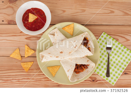 Chili Con Carne on tortilla wrap with salsa sauce Chili Con Carne on tortilla wrap with salsa sauce 37192526