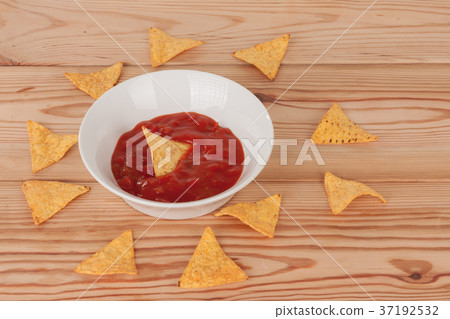 White bowl with salsa sauce and tortilla chips White bowl with salsa sauce and tortilla chips 37192532