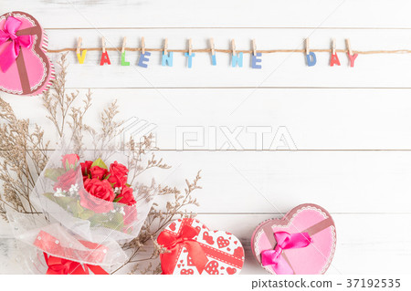 valentine's day text with rose bouquet on wood 37192535