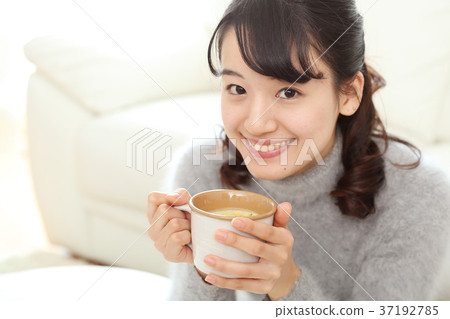 Young girl drinking soup Young girl drinking soup 37192785