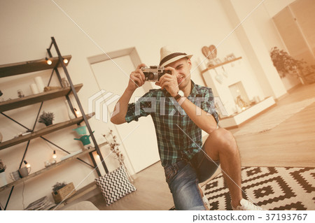 Man take a photo of pregnant woman in loft Man take a photo of pregnant woman in loft 37193767