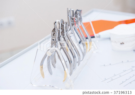Orthodontist Dental set of clamps and pliers Orthodontist Dental set of clamps and pliers 37196313