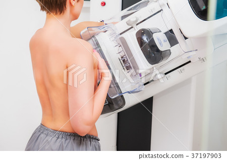 Female patient undergoing mammography test  37197903