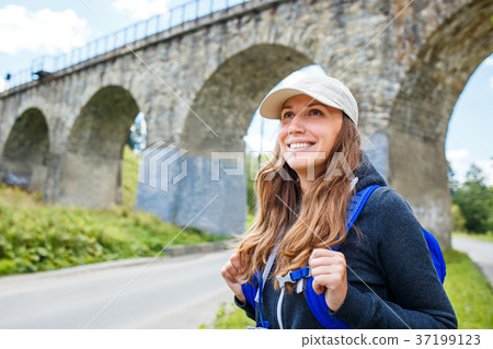 Young happy woman traveling with backpack 37199123