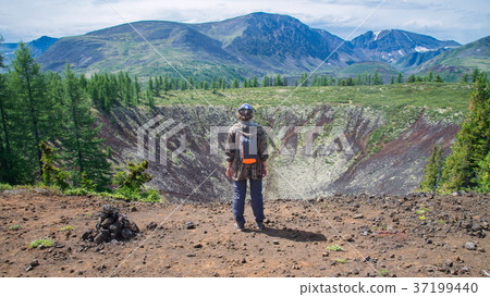 Young lady hiker standing back on top of old 37199440