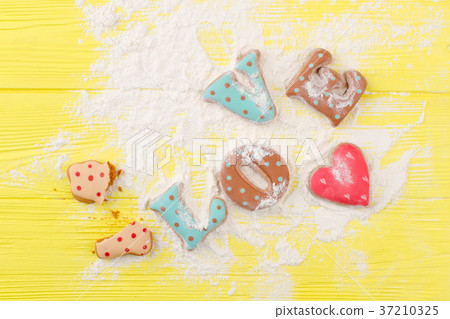 Word love from cookies, sugar powder. Word love from cookies, sugar powder. 37210325