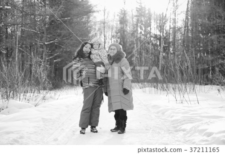 Black and white photo of parent holding kid on 37211165