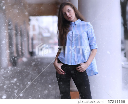 Young girl outdoors in winter. Model girl posing 37211166