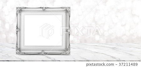 Blank vintage photo frame on white marble table Blank vintage photo frame on white marble table 37211489