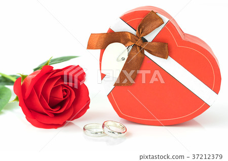 Red rose and heart-shaped box on white Red rose and heart-shaped box on white 37212379