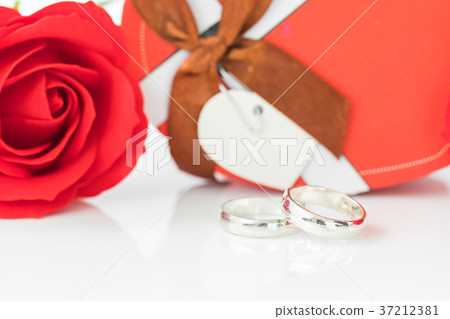 Red rose and heart-shaped box on white 37212381