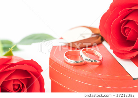 Red rose and heart-shaped box on white 37212382