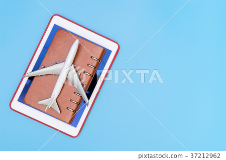 Toy plane on Notebook and Tablet blue copy space Toy plane on Notebook and Tablet blue copy space 37212962