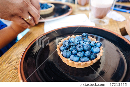 Dessert with blueberries in an edible basket 37213355