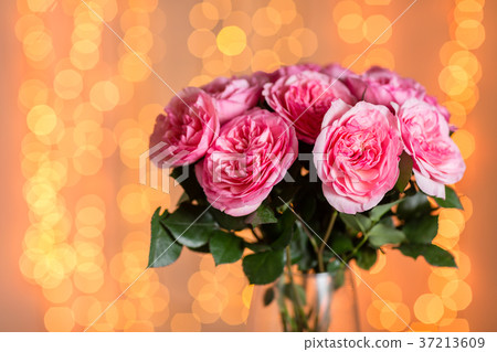 Pink rose. Vase with beautiful bouquet on table 37213609
