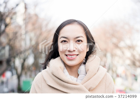 A woman in a coat A woman in a coat 37214099