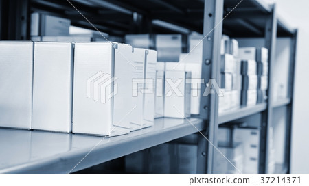 Drug boxes in a shelf in a pharmacy. Store. Drug boxes in a shelf in a pharmacy. Store. 37214371