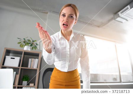 Fierce female arguing in office 37218713