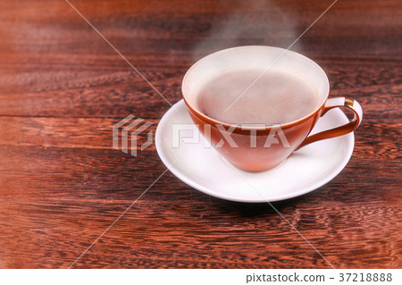 Cup of black coffee on wooden background Cup of black coffee on wooden background 37218888