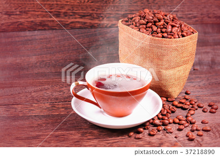 Cup of black coffee and coffee beans in a bag Cup of black coffee and coffee beans in a bag 37218890