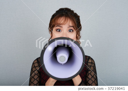Woman with loudspeaker 37219041