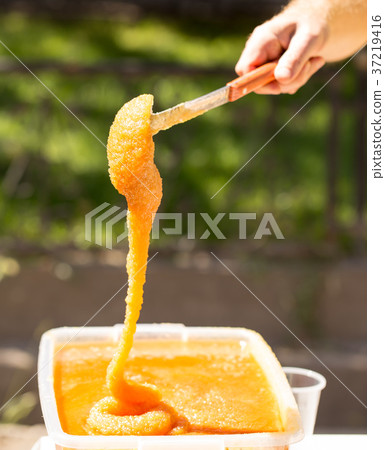 the beekeeper sells honey in the market the beekeeper sells honey in the market 37219416