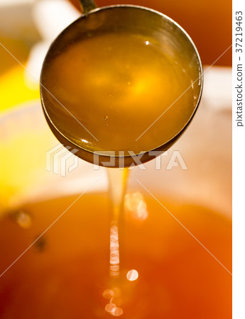 the beekeeper sells honey in the market 37219463