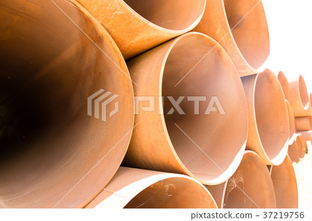 large rusty metal pipes as a background large rusty metal pipes as a background 37219756