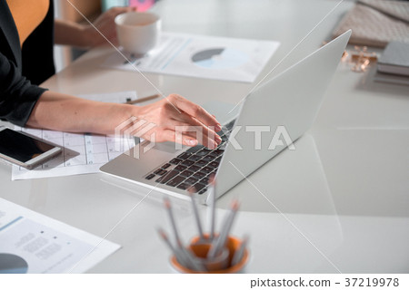Girl arm writing in modern laptop Girl arm writing in modern laptop 37219978