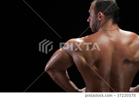 Back view of bodybuilder with muscular relief body 37220378