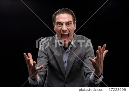 Annoyed young man is screaming Annoyed young man is screaming 37222696