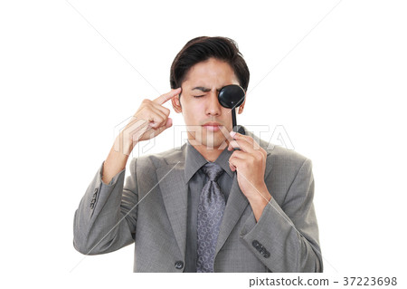 Men undergoing sight test Men undergoing sight test 37223698