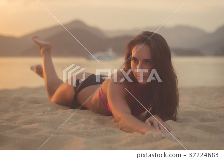 Attractive model with brown hair wearing bikini 37224683