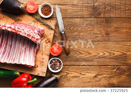 Raw rack of lamb on wooden board Raw rack of lamb on wooden board 37225925