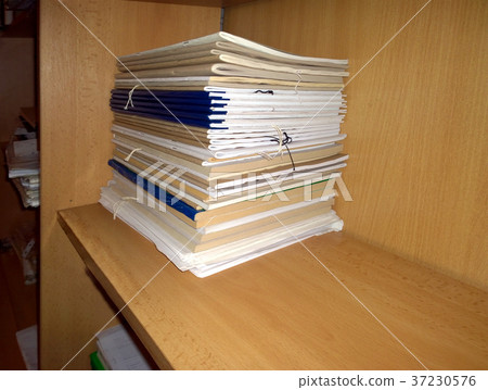 A stack of magazines on a shelf accounting A stack of magazines on a shelf accounting 37230576