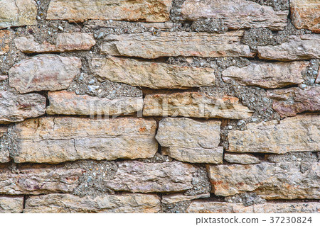 Horizontal shot of texture of a stone wall, old 37230824