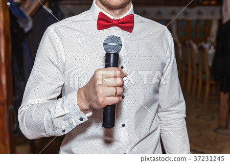 Master of ceremonies with microphone Master of ceremonies with microphone 37231245